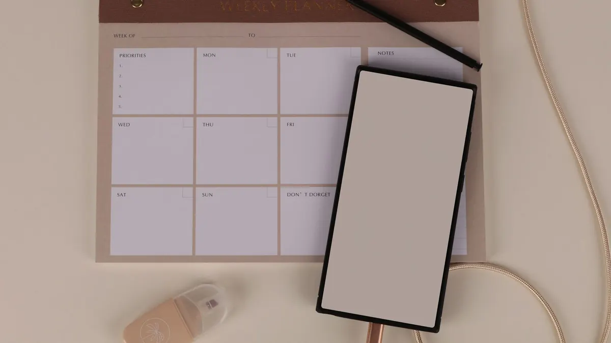 Tablet calendar and phone on a modern desk